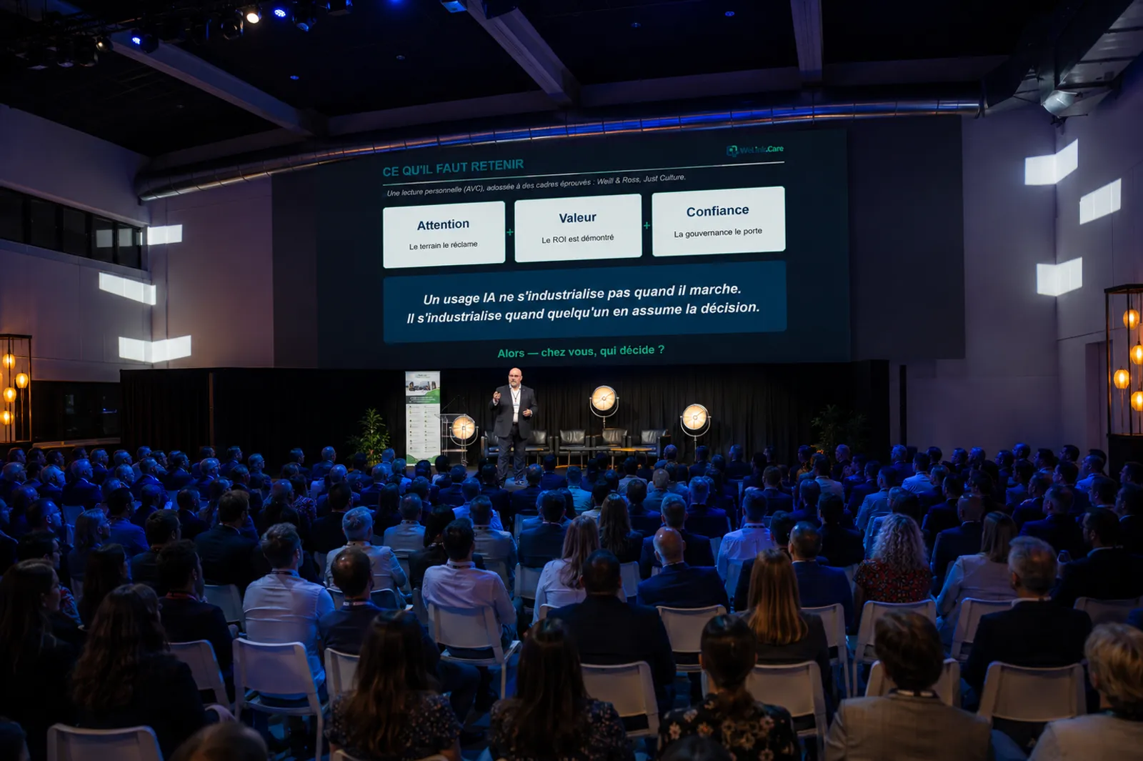 Keynote, in front of a room of executives and professionals.